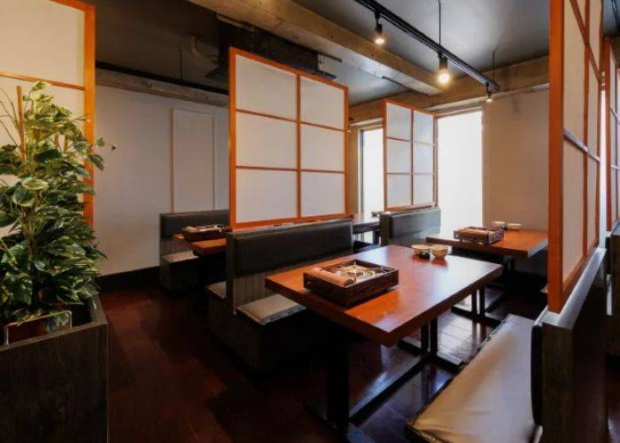 The modern interiors of Shabu Shima with shoji door-style dividers.